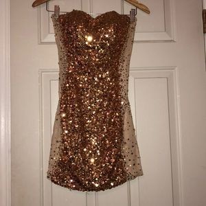 Gold sparkly with sheer sides cocktail dress